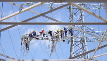 Operators repair a high voltage line in compliance with all safety measures