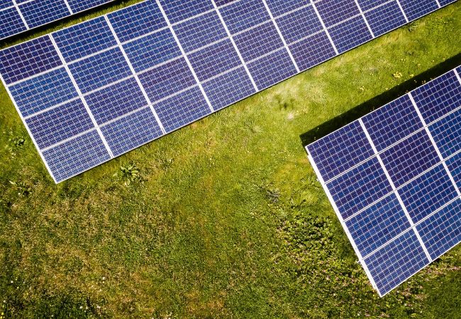 Solar panels in a green field