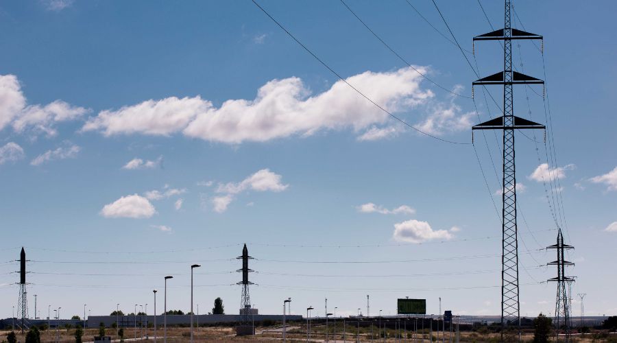 High voltage towers in a valley as a landscape