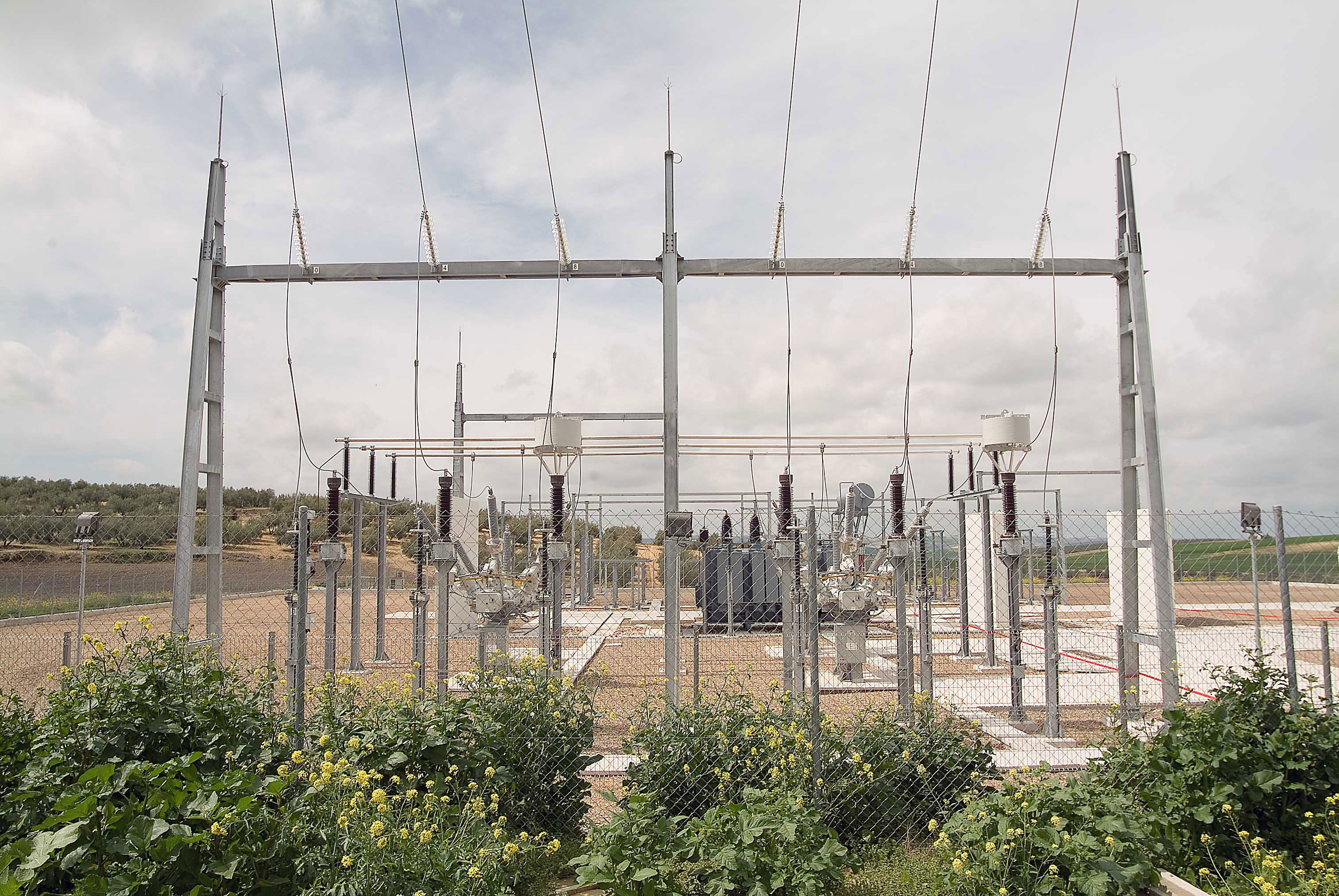 Electrical substation built in the middle of a wide valley